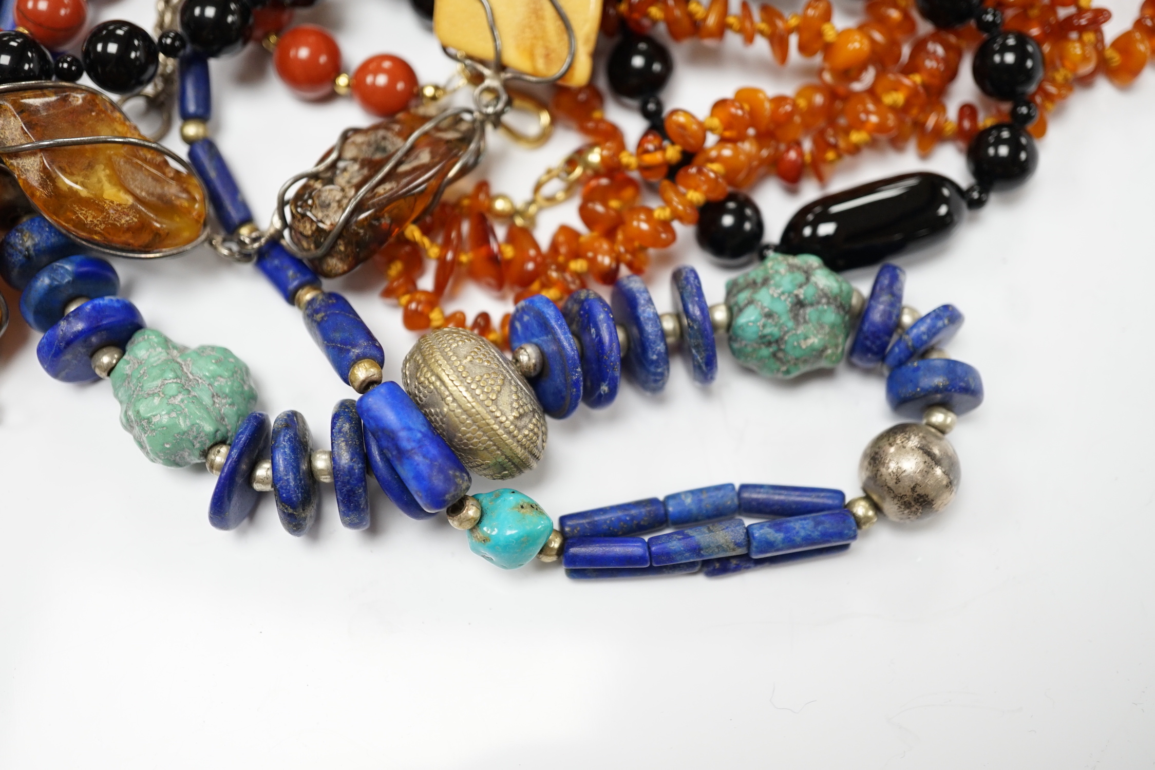 Kai Yin Lo- A twin strand black onyx and jasper bead necklace, 60cm and pair of matching drop earrings and a lapis lazuli and turquoise matrix necklace.